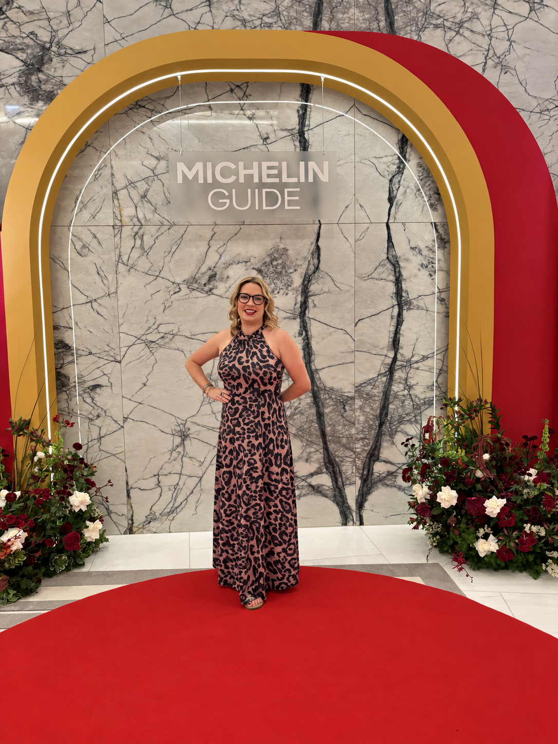 Courtney Brandt beneath the MICHELIN Guide event arch